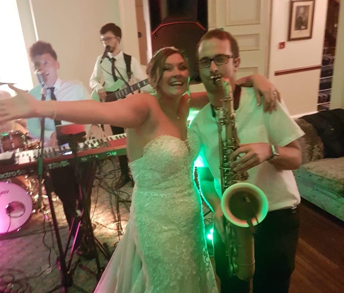 The Bride with Wandering Wings' Sax player