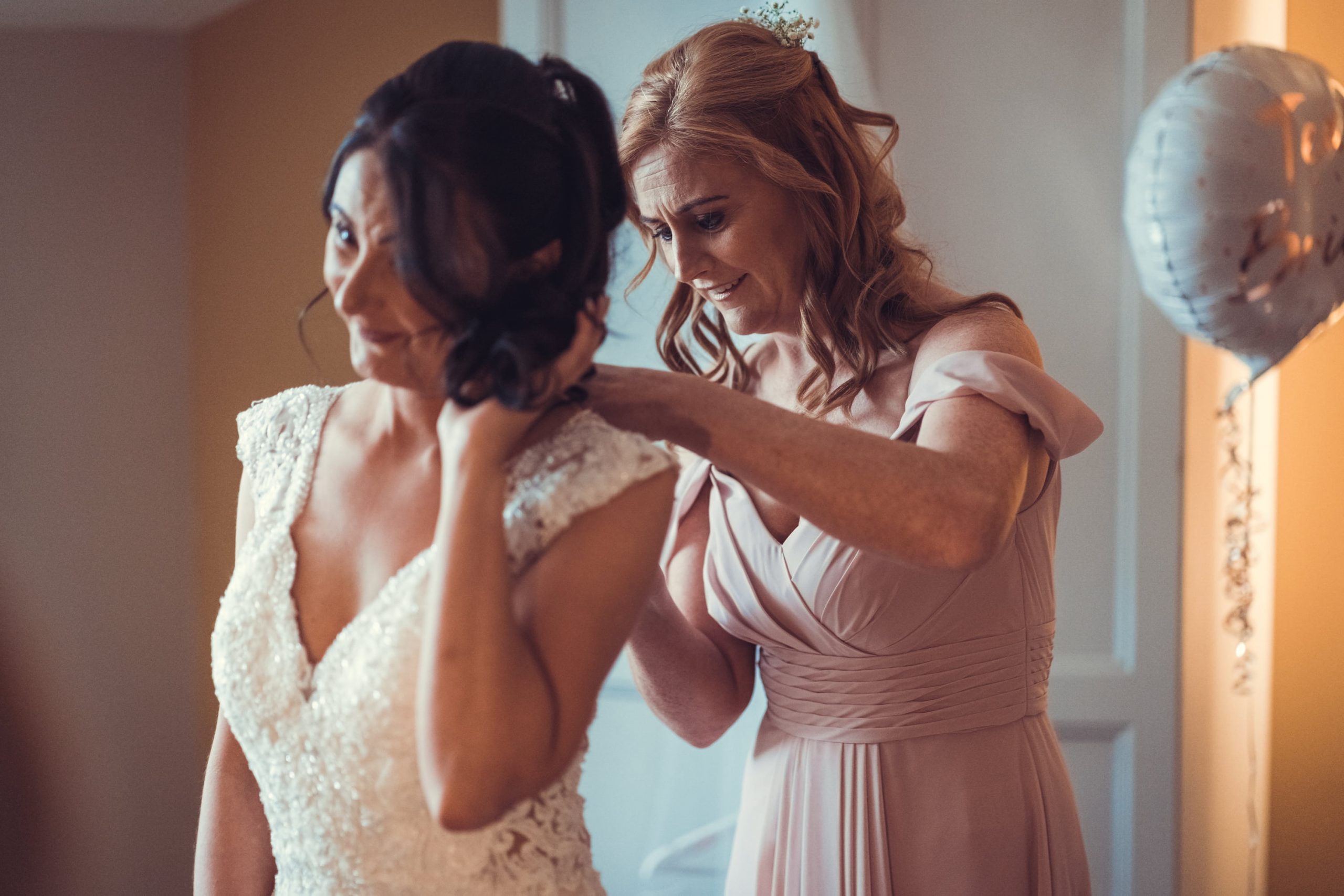 Bride, Tracy, getting ready with bridesmaid