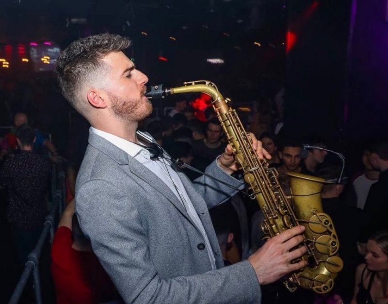 saxophonist at corporate party