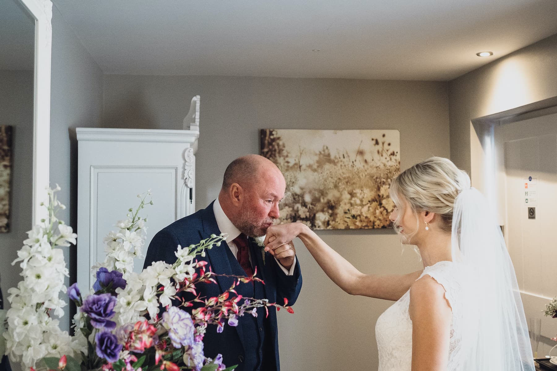 Father of the bride kissing Steph's hand