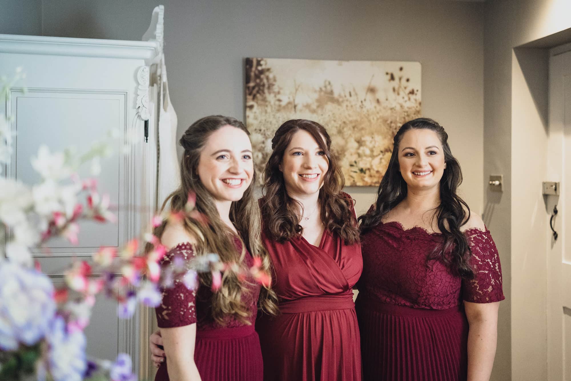 Bridesmaids in deep red dresses