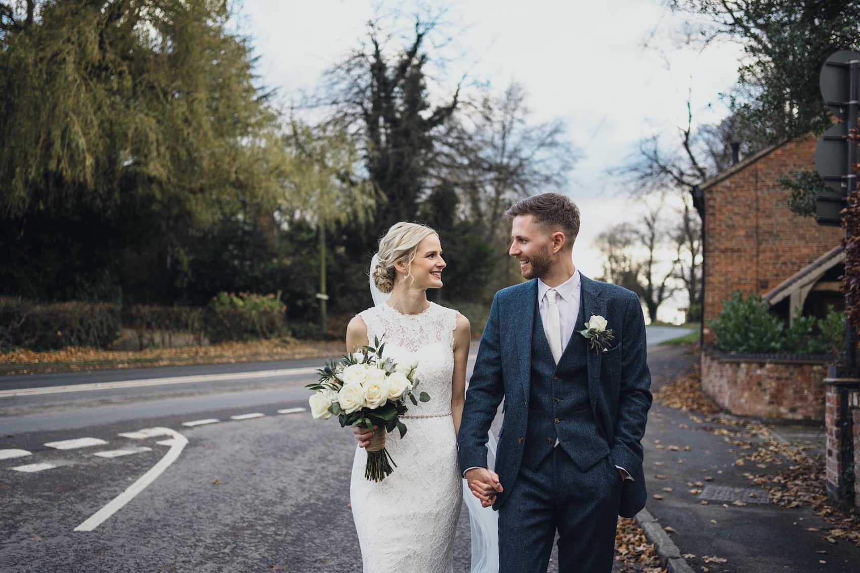 Steph and Bertie newlyweds walking down street