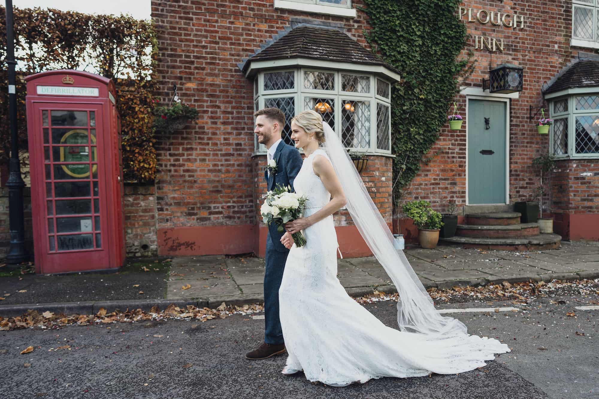 Steph and Bertie walking down road hand in hand