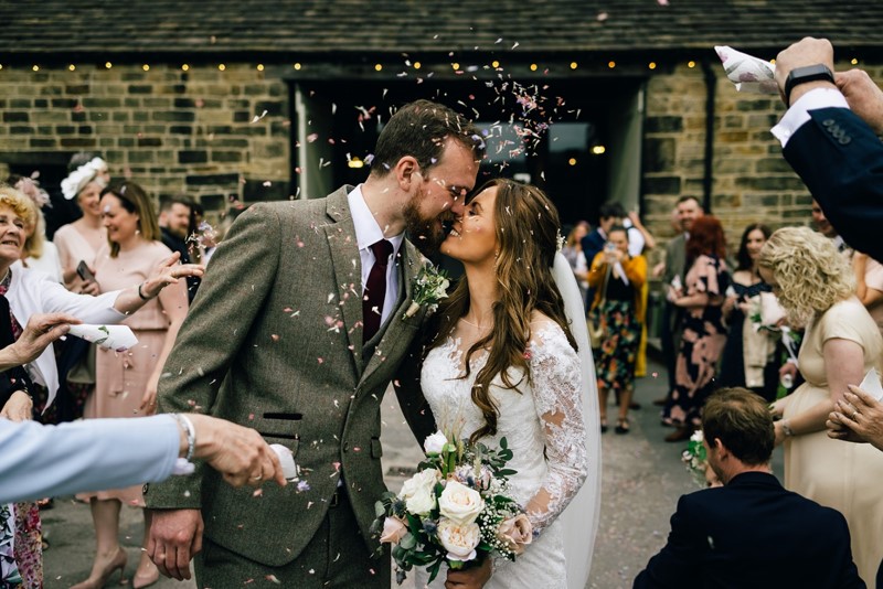 Confetti wedding kiss shot