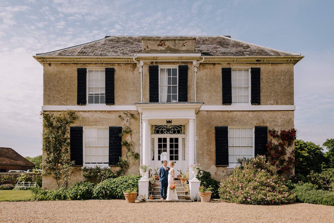 Newlyweds in front of venue