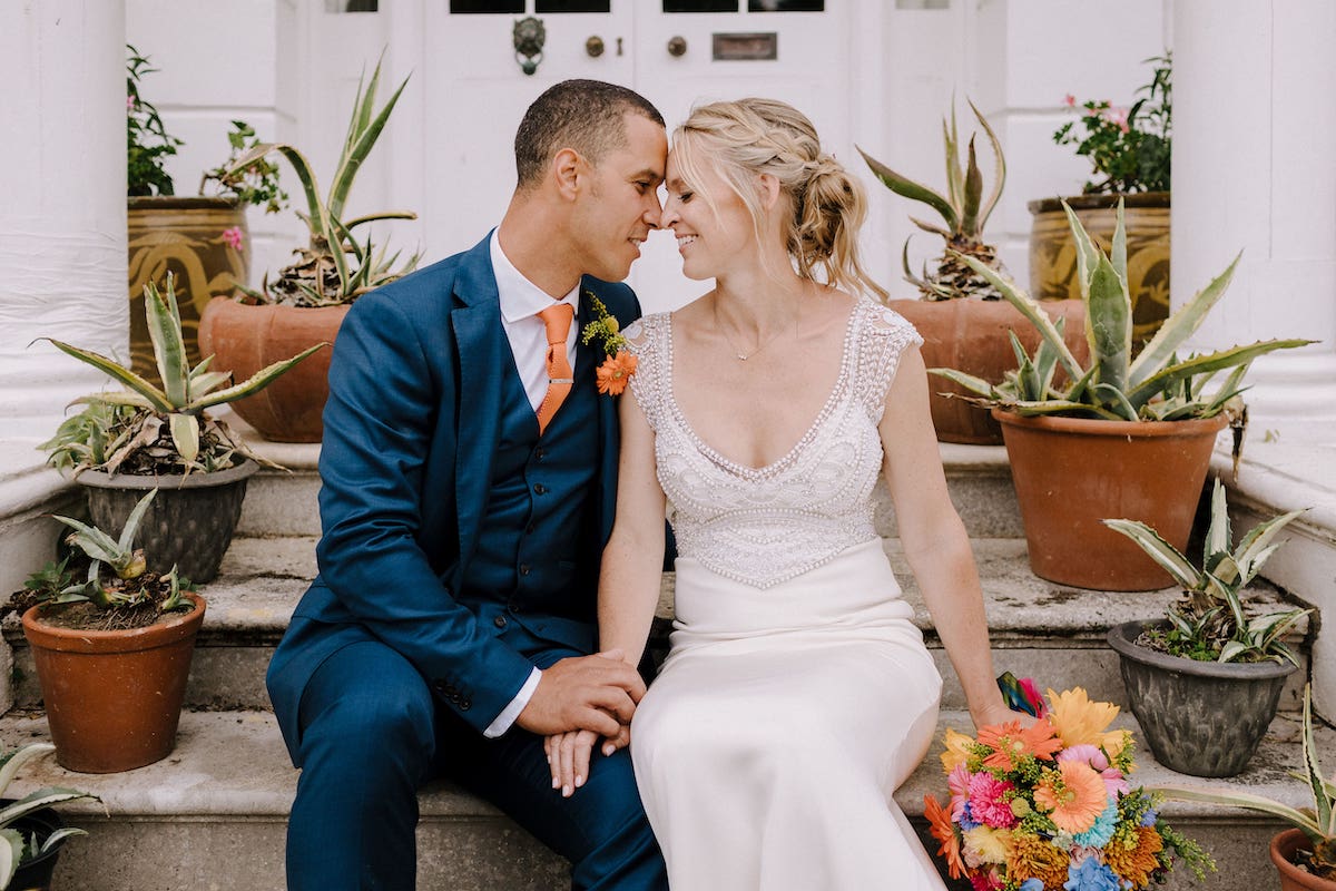 Wedding couple sitting on steps