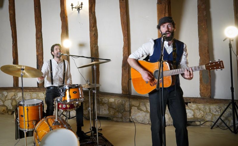 The Broadsmen guitarist and drummer performing live